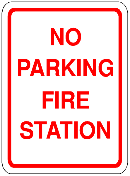 The sign says "no parking fire station". It's a red rectangle with white text on it.