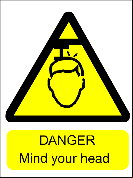 The image shows a yellow hazard sign with black text that reads "DANGER MIND YOUR HEAD" on it.
