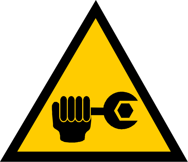 The image shows a warning sign with an icon of a wrench inside it next to a hand holding up another object that resembles a gear wheel.
