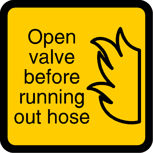 The image shows a yellow sign with black text that reads "OPEN VALVE BEFORE RUNNING OUT OF FIRE EXTINGUISHERS."