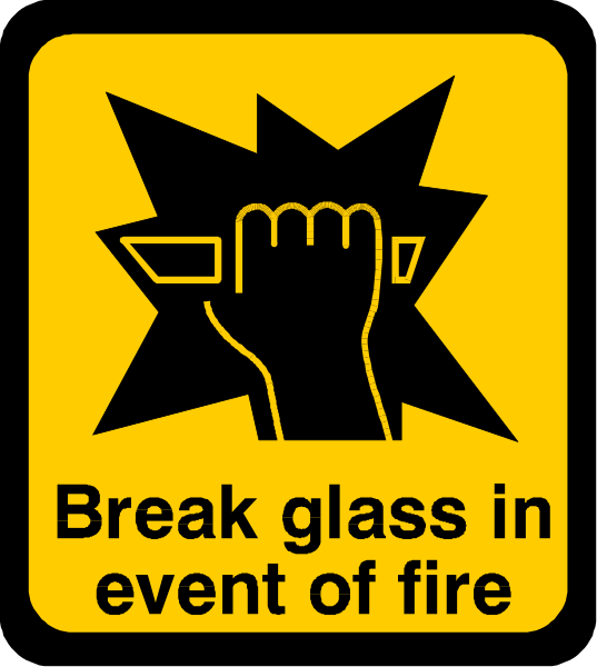 The image shows a yellow sign with black text that reads "BREAK GLASS IN EVENT OF FIRE." There is also an icon of a hand holding a hammer above what appears to be broken glass pieces, suggesting action taken in response to fire emergency.