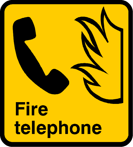 The image shows a yellow sign with black text that reads "FIRE TELEPHONE" accompanied by an illustration of flames on fire telephone equipment.