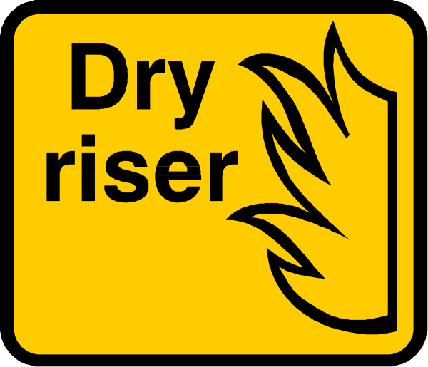 The image shows a sign with text that reads "DRY RISER" on it along with an icon of flames atop a building silhouette.