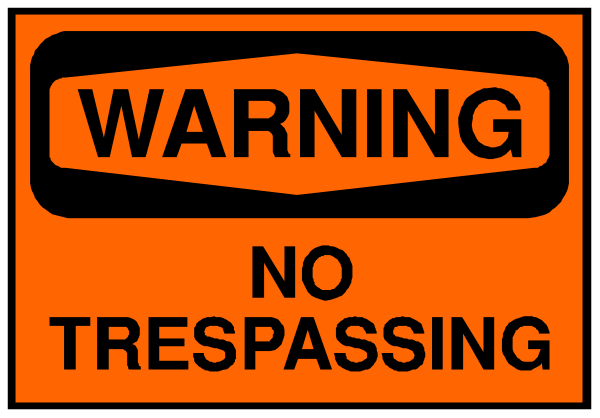 The image shows a warning sign with text that reads "WARNING NO TRESPASSING."