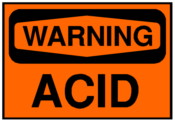 The image shows a warning sign with an orange background that says "WARNING ACID" on it.