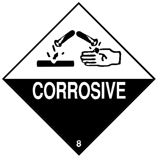 The image shows a black diamond with white text on it that reads "CORROSIVE" at the bottom right corner of an object resembling a bomb-like structure in front of which there is another smaller sign depicting two hands holding up what appears to be a piece of paper or cardboard.