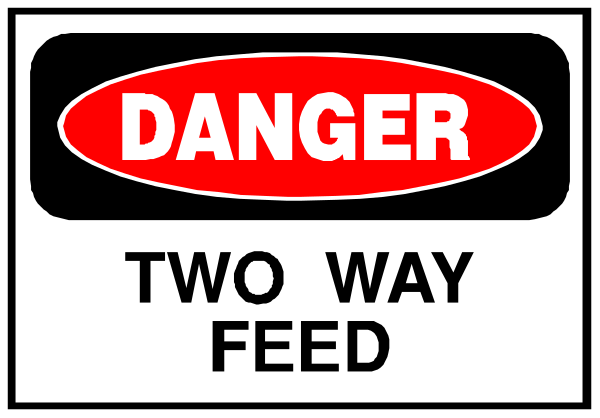 The image shows a sign with text that reads "DANGER TWO WAY FEED" along with an arrow pointing to its right side indicating two-way traffic ahead.