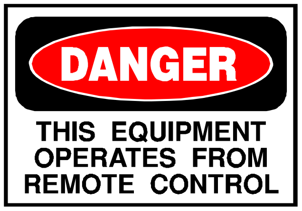 The image shows a warning sign with text that reads "DANGER" at top followed by an exclamation mark in red font on black background; below it is additional white text stating "THIS EQUIPMENT OPERATES FROM REMOTE CONTROL."