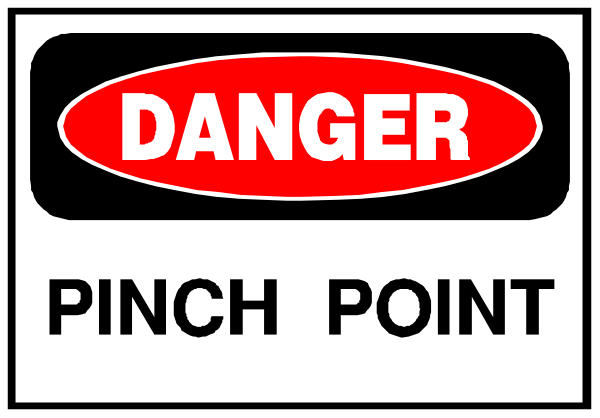 The image shows a sign with text that reads "DANGER PINCH POINT" at the top right corner in white letters on an orange background within a black border. Below this is another line of red and yellow stripes, followed by two lines of bold capitalized words: DANGER above a picture of a pinch point symbolizing caution or danger related to construction zones where workers may be exposed to hazards such as falling objects from overhead work areas.