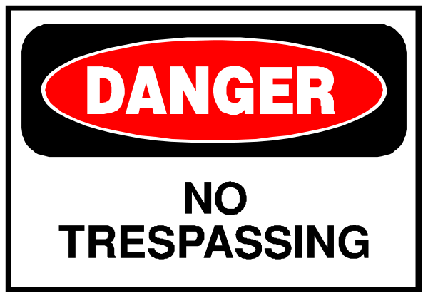 The image shows a sign with text that reads "DANGER TRESPASSING NO PARKING" on it.
