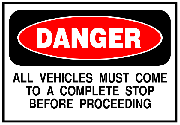 The image shows a warning sign with text that reads "DANGER" at top followed by instructions to stop before proceeding further due to construction work ahead.