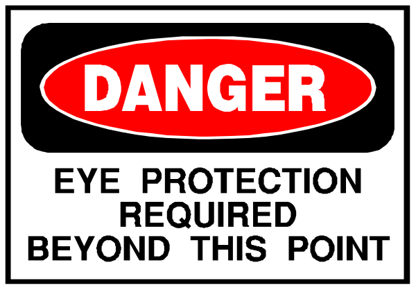 The image shows a warning sign with text that reads "DANGER EYE PROTECTION REQUIRED BEYOND THIS POINT."