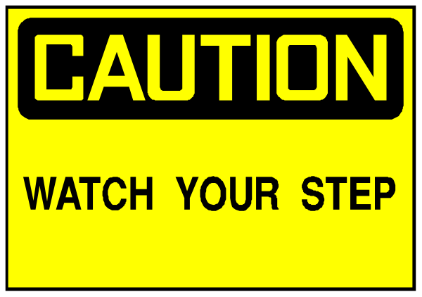 The image shows a caution sign with text that reads "CAUTION" at top followed by an arrow pointing to the right indicating you should watch your step below it.
