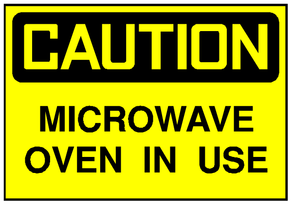 The image shows a yellow caution sign with black text that reads "CAUTION MICROWAVE OVEN IN USE."