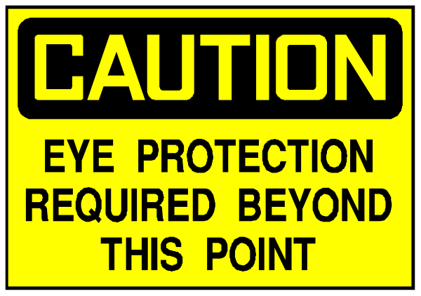 The image shows a caution sign with text that reads "CAUTION EYE PROTECTION REQUIRED BEYOND THIS POINT."