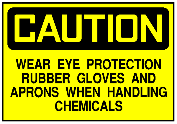 The image shows a yellow caution sign with black text that reads "CAUTION WEAR EYE PROTECTION RUBBER GLOVES AND APRONS WHEN HANDLING CHEMICALS."