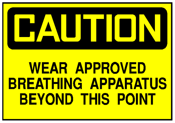 The image shows a caution sign with text that reads "CAUTION" at top followed by instructions to wear an approved breathing apparatus beyond this point.