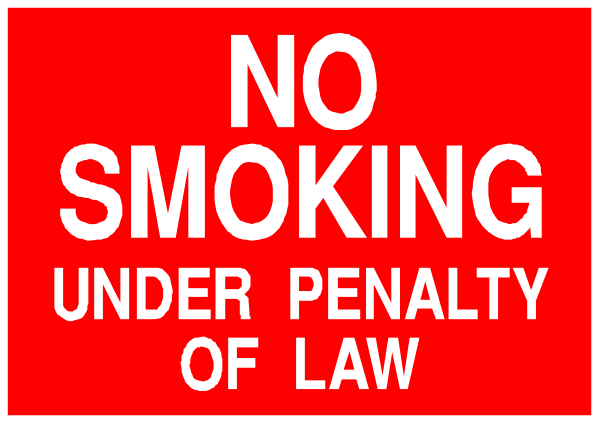 The image shows a red sign with white text that reads "NO SMOKING UNDER PENALTY OF LAW."