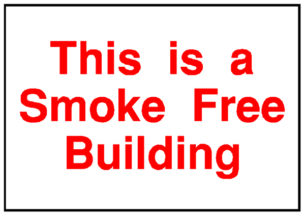 The image shows a sign with text that reads "This is a smoke free building."
