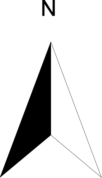 The image shows a black and white photo of an open book with pages facing each other; it's taken from above at an angle where one page is partially visible while another fills most of the frame.