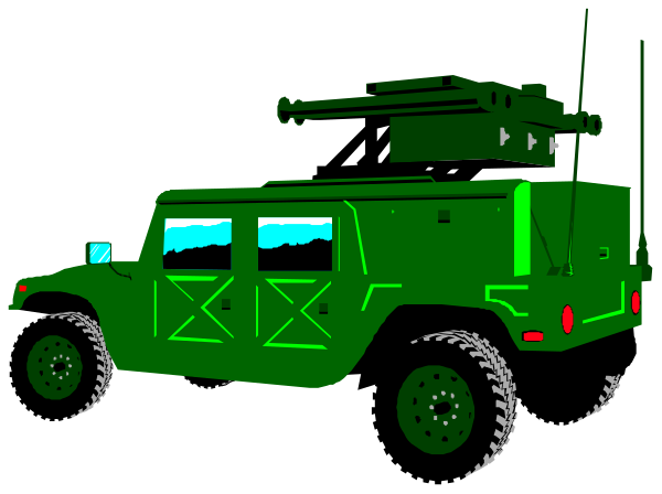 The image shows a green military truck with an antenna on top parked next to another vehicle at night under dark skies.