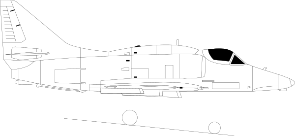 The image shows a fighter jet with its canopy open on an aircraft carrier deck at nighttime.