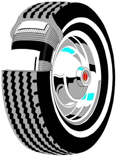 The image shows a black tire with white lettering on it inside of what appears to be an engine cover that has been cut out for display purposes.