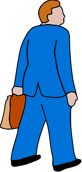The image shows a man walking down an alleyway with his briefcase under his arm; he is dressed professionally wearing blue suit pants and carrying a brown bag in one hand while holding onto another object that appears to be a tie, which isn't fully visible due to its position behind him.