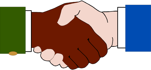 The image shows a hand holding an object with two fingers extended upwards while pointing at something offscreen to its right side.