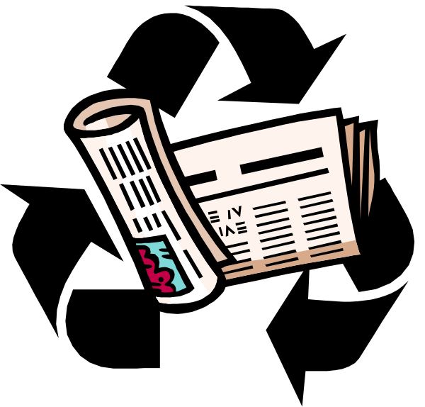The image shows a newspaper with visible text on it placed next to an open booklet that appears blank inside; both items rest atop what looks like a black surface against a dark background.