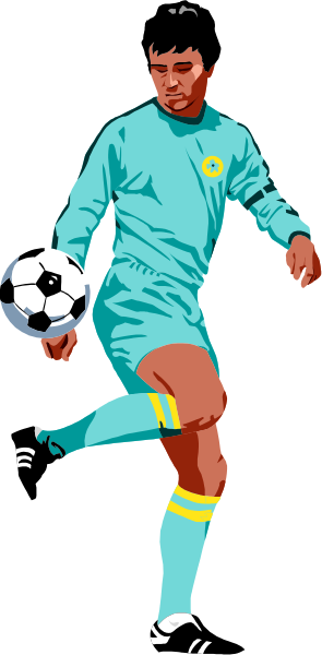 The image shows a soccer player wearing blue shorts with yellow stripes on them kicking a ball while standing next to it.