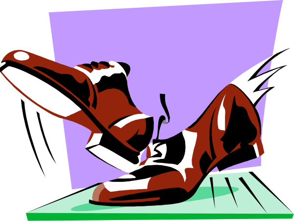 The image shows a single red shoe with its toe pointing upwards against an indistinct background that appears to be purple in color.