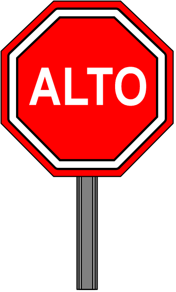The image shows a stop sign with an additional word "ALTO" on it placed against a blurred background that appears to be out of focus.