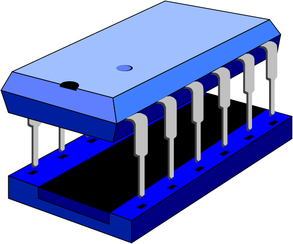 The image shows a blue circuit board with electronic components on it next to an unrelated object that appears to be a small wooden structure resembling a house.