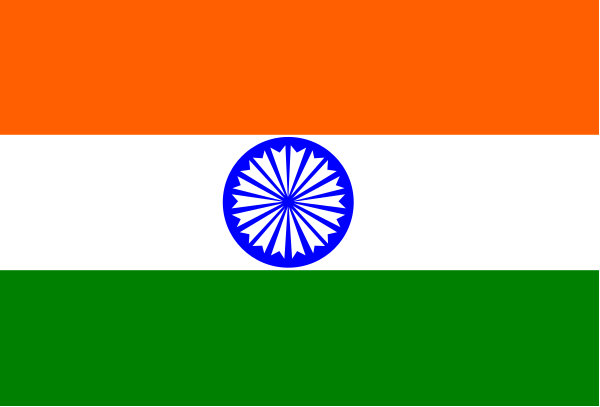 The flag of India with a blue star on it flying over another smaller flag that is red white and green striped.