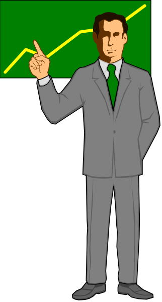 The image shows a man standing behind an open door with his hand on hip pointing upwards towards it; he is wearing a suit jacket over a shirt without tie, dark pants, white shoes, and has short hair.