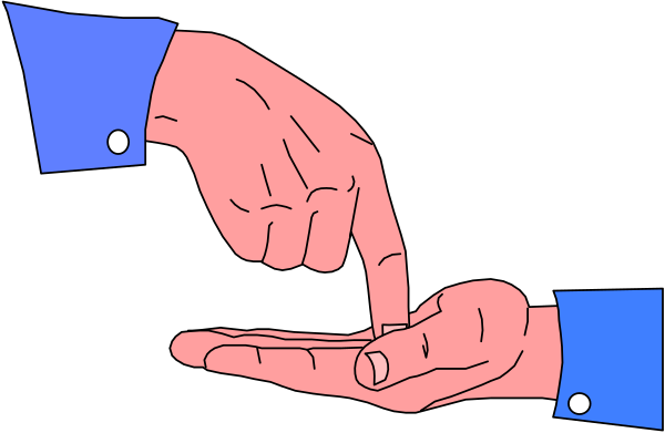 The image shows a hand holding an object that resembles a cell phone with its screen facing upwards towards another person's face who is out of frame in what appears to be a dark room.
