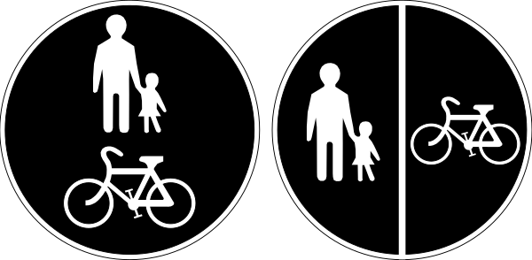 The black and white silhouette of a sign with symbols for different modes of transportation: walking person, bicycle rider, car driver, pedestrian crossing symbol, family on bike path, child in stroller next to adult figure, man riding skateboard or long board, woman pushing baby carriage.