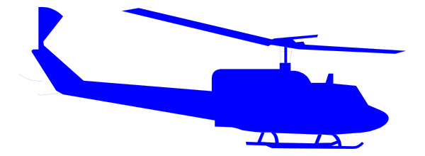 The image shows a blue helicopter with its rotors down on top of what appears to be an aircraft carrier deck at nighttime.