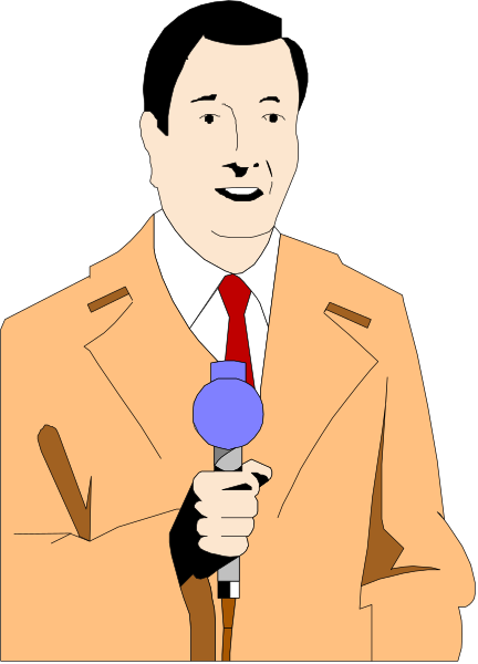 The image shows a man standing behind a microphone on stage with his hand to his mouth as if speaking into it; he is wearing an orange jacket over a red shirt and has dark hair styled in a side parting, along with what appears to be a mustache or beard stubble.