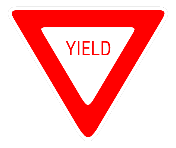 The image shows a red yield sign with white text that reads "YIELD."
