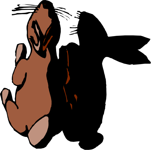 The black and white photo shows a cartoon of an orange bird with its wings spread wide against a dark background.