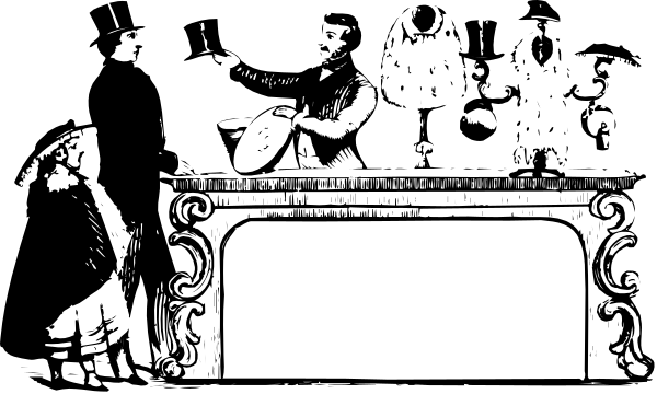 The black and white photo shows a person sitting at an old desk with papers on it.
