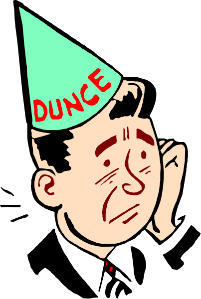 The cartoon shows a man wearing party hat with "Dunce" written on it, looking surprised while holding his head in hands against dark background.