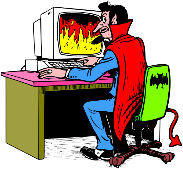 The cartoon shows a man sitting at his desk with two computer monitors; he is wearing glasses and has red hair. He's dressed in blue jeans and a white shirt. On one monitor there appears to be an image of flames, suggesting that something on it might have caught fire or caused some sort of emergency situation requiring attention. The other screen displays what looks like the Batman logo with wings around his head. To the right side of this scene is another man sitting in front of a computer; he's wearing red and blue clothing resembling Superhero attire, complete with