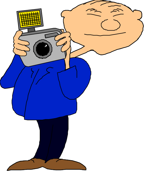 The cartoon shows a man holding up an old camera to his face while standing next to another character who is looking at him with their hands on hips in front of what appears to be a blue wall background.