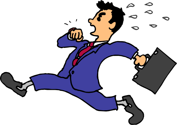 The cartoon shows a man dressed as an executive with his hands on hips while sitting down; he is wearing a suit jacket over a blue shirt, has dark hair, and appears to be in mid-conversation or listening intently.