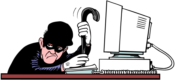 The cartoon shows a man sitting at his desk with an open laptop computer on it; he is wearing glasses and appears to be working intently while looking downward towards something off-screen.