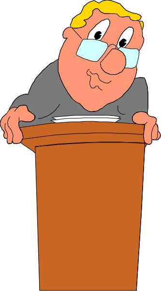 The cartoon shows a man standing behind an orange podium with his hands on it; he is wearing glasses and has gray hair.