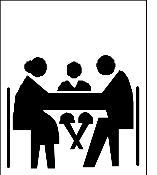 The black and white silhouette of a family sitting at an outdoor dining table with food items on it under what appears to be a tree canopy during daylight hours.